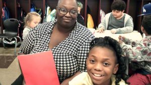 A third grade student and his guest during family day.