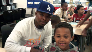 A third grade student and his guest during family day.