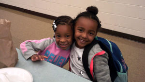 Two Jefferson students pose for the camera as they wait for their pancakes.