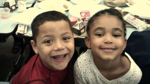 Two Jefferson students smile for the camera after they have finished their pancake breakfast.