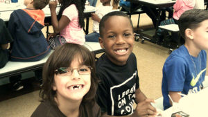 Two Jefferson students smile for the camera after they have finished their pancake breakfast.