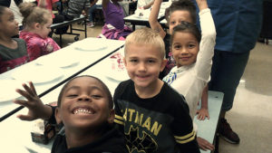 four Jefferson students pose for a picture during their pancake breakfast.