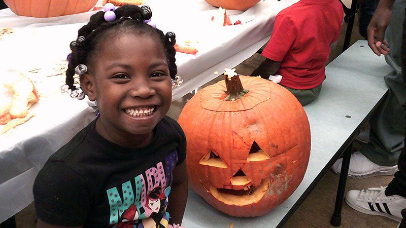 A Jefferson kindergarten student shows off her finished pumpkin.
