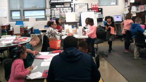 An overview of one of the first grade classes working on activities for family day.
