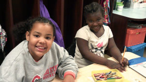 Two Jefferson students having fun while working on their book crafts.