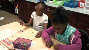 Two Jefferson students working on their book craft.