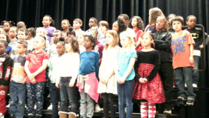 Second grade students performing during the program.