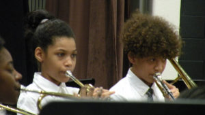 Two band students performing during the concert.