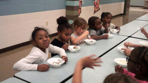 Kindergarten students enjoying their ice cream.