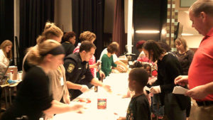 Students waiting in line ready to receive their ice cream reward.