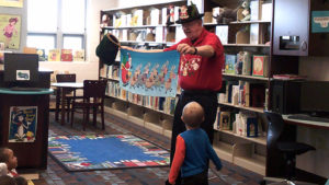 A student volunteers for a magic trick.