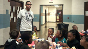 Pastor Todd making sure all the students have what they need for the Thanksgiving lunch.