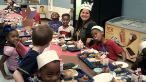 Mrs. Rhodes and several of her students enjoying the Thanksgiving lunch.