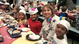 Mrs. Sauer and three of her students enjoying their Thanksgiving meal.