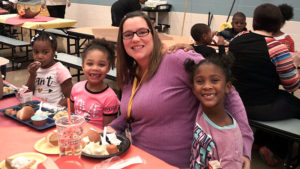 Mrs. Haswell and two of her students enjoying lunch together.