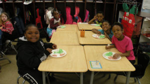 First graders enjoying their special breakfast.