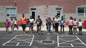 Harding students dance with some of the third graders.