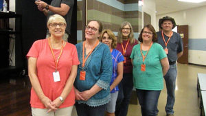 Volunteers from the church help pass out the bikes to excited kindergarten students.