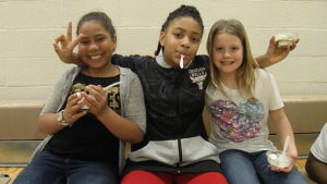 Three Jefferson students enjoy their ice cream during the dance.
