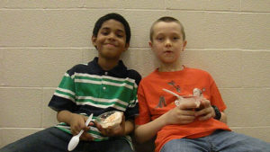 Two students enjoy their ice cream reward.