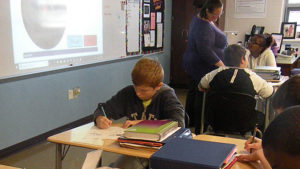 A student working hard on his assignment.