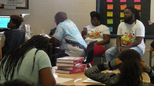 Families observe their students working in the classroom.