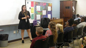 Miss Komsa explaining to the families what the students have learned for the nine weeks.