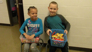 Student helpers waiting for classrooms to walk by.