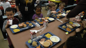 Students enjoy a full Thanksgiving meal.