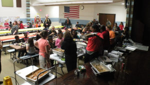 Staff serves the students their special lunch.