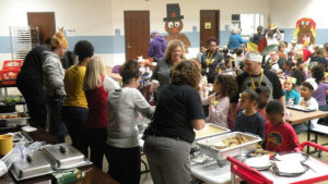 Staff serves the students their special lunch.