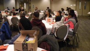 Students listen to a forum during the conference.