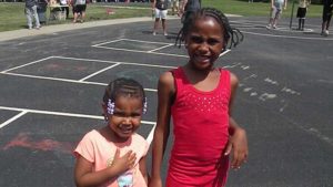 Two sisters arrive at the carnival.