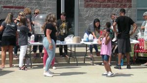 A student and teacher show off their dance skills.