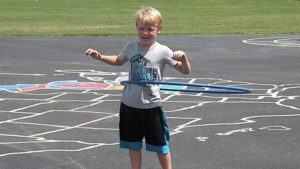 A student shows off his hula hoop skills.