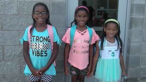 Girls pose for a quick picture before the school day begins.