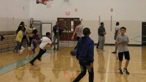 Students from Jefferson and Harding playing games in the gym.