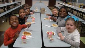 Kindergarten enjoying their pancakes.