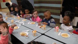 Kindergarten enjoying their pancakes.