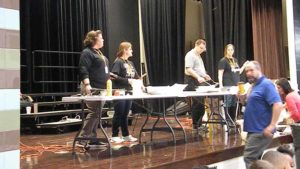 Staff working on cooking pancakes for the students.