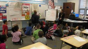 Students listening to their guest reader.