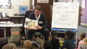 Our guest reader showing a picture in the book he is reading.