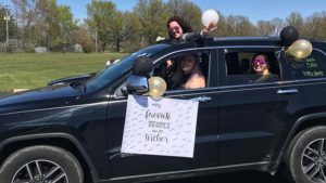 Miss Davia, Miss D'Alio and Miss Krcelic ready for the parade. A sign hangs from her car saying my favorite people call me teacher.