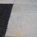 Bright yellow W's have been painted on the sidewalks to remind students to social distance.