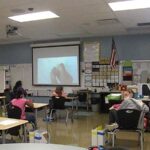 Fourth grade students in a socially distanced math class.