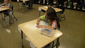 A student answers questions about the pumpkin