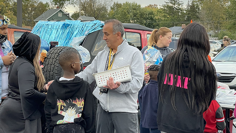 Mr. Israel passing out candy.