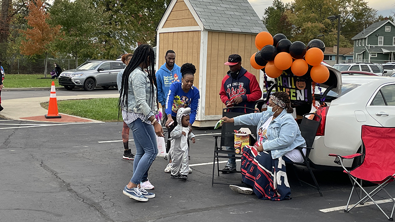 Families get candy from a member of Second Baptist Church.