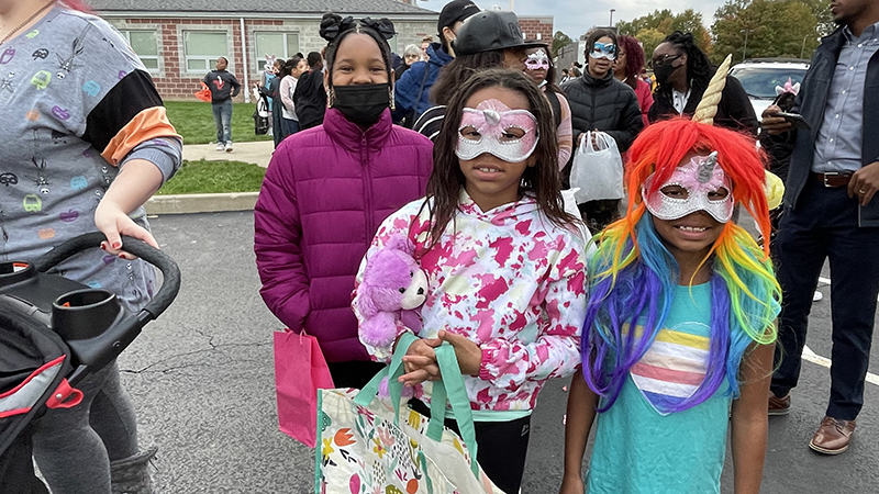 Students dressed up and excited for trunk or treat.