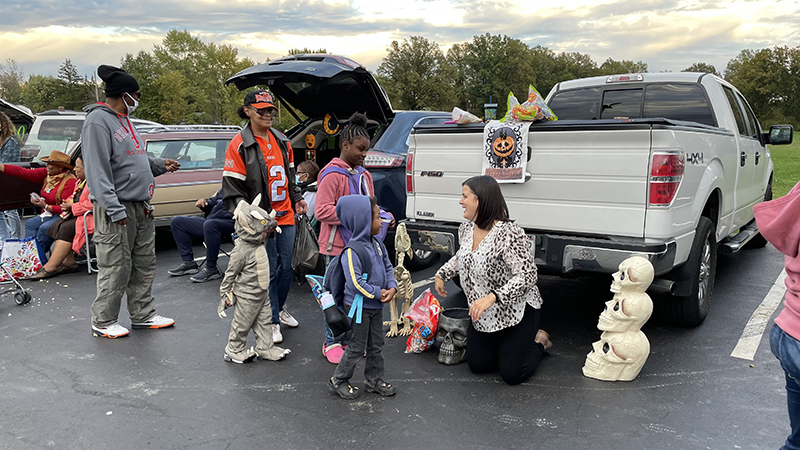 Mrs. Rhodes passing out candy to families.